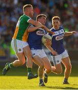 29 June 2019; Martin Scully of Laois is tackled by Declan Hogan of Offaly during the GAA Football All-Ireland Senior Championship Round 3 match between Laois and Offaly at O'Moore Park in Portlaoise, Laois. Photo by Eóin Noonan/Sportsfile