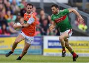 29 June 2019; Jamie Clarke of Armagh evades Chris Barrett of Mayo during the GAA Football All-Ireland Senior Championship Round 3 match between Mayo and Armagh at Elverys MacHale Park in Castlebar, Mayo. Photo by Ben McShane/Sportsfile