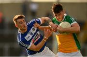 29 June 2019; Eoin Carroll of Offaly is tackled by Trevor Collins of Laois during the GAA Football All-Ireland Senior Championship Round 3 match between Laois and Offaly at O'Moore Park in Portlaoise, Laois. Photo by Eóin Noonan/Sportsfile