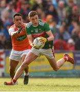 29 June 2019; Fionn McDonagh of Mayo in action against Jemar Hall of Armagh during the GAA Football All-Ireland Senior Championship Round 3 match between Mayo and Armagh at Elverys MacHale Park in Castlebar, Mayo. Photo by Ben McShane/Sportsfile