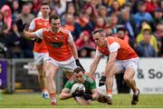 29 June 2019; Keith Higgins of Mayo is fouled by Brendan Donaghy, left, and Mark Shields of Armagh during the GAA Football All-Ireland Senior Championship Round 3 match between Mayo and Armagh at Elverys MacHale Park in Castlebar, Mayo. Photo by Ben McShane/Sportsfile