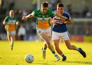 29 June 2019; Niiall McNamee of Offaly in action against Robert Pigott of Laois during the GAA Football All-Ireland Senior Championship Round 3 match between Laois and Offaly at O'Moore Park in Portlaoise, Laois. Photo by Eóin Noonan/Sportsfile
