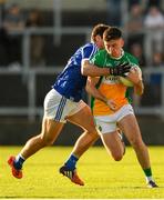 29 June 2019; Ruairi McNamee of Offaly is tackled by Gareth Dillon of Laois during the GAA Football All-Ireland Senior Championship Round 3 match between Laois and Offaly at O'Moore Park in Portlaoise, Laois. Photo by Eóin Noonan/Sportsfile