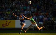 29 June 2019; Robert Pigott of Laois scores a point despite the efforts of Mark Abbott of Offaly during the GAA Football All-Ireland Senior Championship Round 3 match between Laois and Offaly at O'Moore Park in Portlaoise, Laois. Photo by Eóin Noonan/Sportsfile