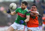 29 June 2019; Chris Barrett of Mayo is tackled by Jemar Hall of Armagh during the GAA Football All-Ireland Senior Championship Round 3 match between Mayo and Armagh at Elverys MacHale Park in Castlebar, Mayo. Photo by Brendan Moran/Sportsfile