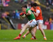 29 June 2019; Cillian O'Connor of Mayo in action against Paddy Burns of Armagh during the GAA Football All-Ireland Senior Championship Round 3 match between Mayo and Armagh at Elverys MacHale Park in Castlebar, Mayo. Photo by Brendan Moran/Sportsfile