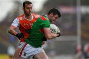 29 June 2019; Brendan Harrison of Mayo is tackled by Jamie Clarke of Armagh during the GAA Football All-Ireland Senior Championship Round 3 match between Mayo and Armagh at Elverys MacHale Park in Castlebar, Mayo. Photo by Brendan Moran/Sportsfile