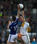 29 June 2019; Paddy Dunican of Offaly in action against Evan Carroll of Laois during the GAA Football All-Ireland Senior Championship Round 3 match between Laois and Offaly at O'Moore Park in Portlaoise, Laois. Photo by Eóin Noonan/Sportsfile