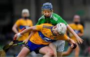 30 June 2019; Adam Hogan of Clare in action against Patrick O’Donovan of Limerick during the Electric Ireland Munster GAA Hurling Minor Championship Final match between Limerick and Clare at LIT Gaelic Grounds in Limerick. Photo by Brendan Moran/Sportsfile
