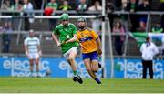 30 June 2019; Adam Murrihy of Limerick in action against Conner Hegarty of Clare during the Electric Ireland Munster GAA Hurling Minor Championship Final match between Limerick and Clare at LIT Gaelic Grounds in Limerick. Photo by Brendan Moran/Sportsfile