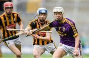 30 June 2019; David Codd of Wexford in action against Jack Doyle of Kilkenny during the Leinster GAA Hurling Minor Championship Final match between Kilkenny and Wexford at Croke Park in Dublin. Photo by Ramsey Cardy/Sportsfile