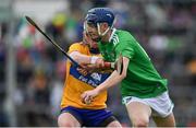 30 June 2019; Eddie Stokes of Limerick in action against Adam Hogan of Clare during the Electric Ireland Munster GAA Hurling Minor Championship Final match between Limerick and Clare at LIT Gaelic Grounds in Limerick. Photo by Brendan Moran/Sportsfile