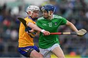 30 June 2019; Eddie Stokes of Limerick in action against Adam Hogan of Clare during the Electric Ireland Munster GAA Hurling Minor Championship Final match between Limerick and Clare at LIT Gaelic Grounds in Limerick. Photo by Brendan Moran/Sportsfile
