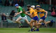 30 June 2019; Patrick Reale of Limerick in action against Clare players Jarlath Collins, Cormac Murphy and Oisin Clune during the Electric Ireland Munster GAA Hurling Minor Championship Final match between Limerick and Clare at LIT Gaelic Grounds in Limerick. Photo by Brendan Moran/Sportsfile