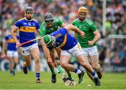 30 June 2019; John O'Dwyer of Tipperary is tackled by Gearoid Hegarty and Richie English of Limerick during the Munster GAA Hurling Senior Championship Final match between Limerick and Tipperary at LIT Gaelic Grounds in Limerick. Photo by Brendan Moran/Sportsfile