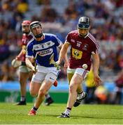 30 June 2019; Eoin Price of Westmeath in action against John Lennon of Laois during the Joe McDonagh Cup Final match between Laois and Westmeath at Croke Park in Dublin. Photo by Ray McManus/Sportsfile