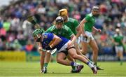 30 June 2019; James Barry of Tipperary is tackled by Peter Casey and Tom Morrissey of Limerick during the Munster GAA Hurling Senior Championship Final match between Limerick and Tipperary at LIT Gaelic Grounds in Limerick. Photo by Brendan Moran/Sportsfile