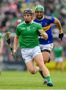 30 June 2019; Peter Casey of Limerick races clear of James Barry of Tipperary during the Munster GAA Hurling Senior Championship Final match between Limerick and Tipperary at LIT Gaelic Grounds in Limerick. Photo by Brendan Moran/Sportsfile