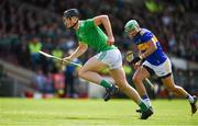 30 June 2019; Kyle Hayes of Limerick races clear of James Barry of Tipperary on the way to scoring his side's second goal during the Munster GAA Hurling Senior Championship Final match between Limerick and Tipperary at LIT Gaelic Grounds in Limerick. Photo by Brendan Moran/Sportsfile