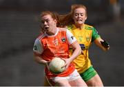 30 June 2019; Niamh Marley of Armagh in action against Evelyn McGinley of Donegal during the Ladies Football Ulster Senior Championship Final match between Armagh and Donegal at St Tiernach's Park in Clones, Monaghan. Photo by Ben McShane/Sportsfile