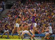 30 June 2019; Wexford joint captain Lee Chin, 11, jumps to catch the dropping sliothar, ahead of Kilkennys Diarmuid O'Keeffe, in what proved to be the last play of the Leinster GAA Hurling Senior Championship Final match between Kilkenny and Wexford at Croke Park in Dublin. Photo by Ray McManus/Sportsfile