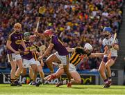30 June 2019; Wexford joint captain Lee Chin, runs towards the wing after catching the dropping sliothar, ahead of Kilkennys Diarmuid O'Keeffe, in what proved to be the last play of the Leinster GAA Hurling Senior Championship Final match between Kilkenny and Wexford at Croke Park in Dublin. Photo by Ray McManus/Sportsfile