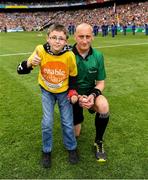 30 June 2019; Pictured is Brandon Burke, from Enable Ireland Children’s Services presenting the match sliotar to referee John Keenan.  Enable Ireland, official charity partner of the GAA, at Croke Park for the Leinster Championship Hurling Final 2019. Photo by Ray McManus/Sportsfile