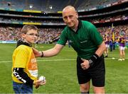 30 June 2019; Pictured is Brandon Burke, from Enable Ireland Children’s Services presenting the match sliotar to referee John Keenan.  Enable Ireland, official charity partner of the GAA, at Croke Park for the Leinster Championship Hurling Final 2019. Photo by Ray McManus/Sportsfile