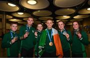 1 July 2019; Team Ireland boxers, from left, Regan Buckley, Michael Nevin, Michaela Walsh, Kurt Walker, Kellie Harrington and Gráinne Walsh with their medals on their return home from the Minsk 2019 European Games at Dublin Airport in Dublin. Photo by Eóin Noonan/Sportsfile