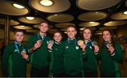 1 July 2019; Team Ireland boxers, from left, Regan Buckley, Michael Nevin, Michaela Walsh, Kurt Walker, Kellie Harrington and Gráinne Walsh with their medals on their return home from the Minsk 2019 European Games at Dublin Airport in Dublin. Photo by Eóin Noonan/Sportsfile
