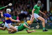 30 June 2019; Tom Morrissey of Limerick, under pressure from Pádraic Maher of Tipperary, passes to team-mate Gearóid Hegarty during the Munster GAA Hurling Senior Championship Final match between Limerick and Tipperary at LIT Gaelic Grounds in Limerick. Photo by Piaras Ó Mídheach/Sportsfile