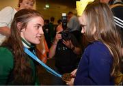 1 July 2019; Team Ireland boxer Gráinne Walsh showing her medal to young supporter Maddie Deehan on her return home from the Minsk 2019 European Games at Dublin Airport in Dublin. Photo by Eóin Noonan/Sportsfile