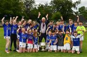 2 July 2019; Uachtarán Chumann Lúthchleas Gael John Horan and players, both boys and girls, from the host club, are photographed with the Sam Maguire Cup at the GAA Football All Ireland Senior Championship Series National Launch at Scotstown GAA Club, St Mary's Park, Scotstown, Co. Monaghan. Photo by Ray McManus/Sportsfile