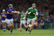 30 June 2019; William O’Donoghue of Limerick in action against Noel McGrath of Tipperary during the Munster GAA Hurling Senior Championship Final match between Limerick and Tipperary at LIT Gaelic Grounds in Limerick. Photo by Piaras Ó Mídheach/Sportsfile