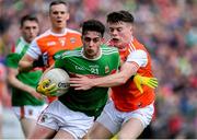 29 June 2019; Ciaran Tracey of Mayo is tackled by Aidan Nugent of Armagh during the GAA Football All-Ireland Senior Championship Round 3 match between Mayo and Armagh at Elverys MacHale Park in Castlebar, Mayo. Photo by Brendan Moran/Sportsfile