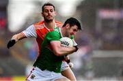 29 June 2019; Brendan Harrison of Mayo is tackled by Jamie Clarke of Armagh during the GAA Football All-Ireland Senior Championship Round 3 match between Mayo and Armagh at Elverys MacHale Park in Castlebar, Mayo. Photo by Brendan Moran/Sportsfile