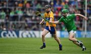 30 June 2019; Adam Murrihy of Limerick in action against Sean Ronan of Clare during the Electric Ireland Munster GAA Hurling Minor Championship Final match between Limerick and Clare at LIT Gaelic Grounds in Limerick. Photo by Brendan Moran/Sportsfile