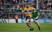 30 June 2019; Adam Murrihy of Limerick in action against Sean Ronan of Clare during the Electric Ireland Munster GAA Hurling Minor Championship Final match between Limerick and Clare at LIT Gaelic Grounds in Limerick. Photo by Brendan Moran/Sportsfile