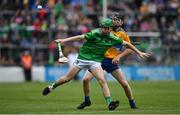 30 June 2019; Adam Murrihy of Limerick in action against Sean Ronan of Clare during the Electric Ireland Munster GAA Hurling Minor Championship Final match between Limerick and Clare at LIT Gaelic Grounds in Limerick. Photo by Brendan Moran/Sportsfile