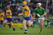 30 June 2019; Shane Meehan of Clare in action against Jimmy Quilty of Limerick during the Electric Ireland Munster GAA Hurling Minor Championship Final match between Limerick and Clare at LIT Gaelic Grounds in Limerick. Photo by Brendan Moran/Sportsfile