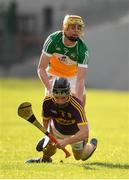 3 July 2019; Niall Murphy of Wexford in action against Killian Sampson of Offaly during the Bord Gais Energy Leinster GAA Hurling U20 Championship Semi-Final match between Offaly and Wexford at Bord na Mona O'Connor Park in Tullamore, Offaly. Photo by Sam Barnes/Sportsfile
