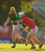 3 July 2019; Eoin Sheehan of Limerick is tackled by Sean O'Leary Hayes of Cork during the Bord Gais Energy Munster GAA Hurling Under 20 Championship Quarter-Final match between Cork and Limerick at Páirc Uí Rinn in Cork. Photo by Eóin Noonan/Sportsfile