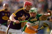 3 July 2019; Conall Clancy of Wexford in action against Ryan Hogan of Offaly during the Bord Gais Energy Leinster GAA Hurling U20 Championship Semi-Final match between Offaly and Wexford at Bord na Mona O'Connor Park in Tullamore, Offaly. Photo by Sam Barnes/Sportsfile