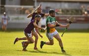 3 July 2019; Conor Butler of Offaly in action against Conall Clancy and Jack Reck of Wexford during the Bord Gais Energy Leinster GAA Hurling U20 Championship Semi-Final match between Offaly and Wexford at Bord na Mona O'Connor Park in Tullamore, Offaly. Photo by Sam Barnes/Sportsfile