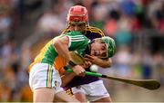 3 July 2019; John Murphy of Offaly in action against Eoin O'Leary of Wexford during the Bord Gais Energy Leinster GAA Hurling U20 Championship Semi-Final match between Offaly and Wexford at Bord na Mona O'Connor Park in Tullamore, Offaly. Photo by Sam Barnes/Sportsfile