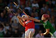 3 July 2019; Shane O'Regan of Cork scores a point despite the efforts of Josh Considine of Limerick during the Bord Gais Energy Munster GAA Hurling Under 20 Championship Quarter-Final match between Cork and Limerick at Páirc Uí Rinn in Cork. Photo by Eóin Noonan/Sportsfile