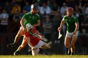 3 July 2019; Shane O'Regan of Cork is tackled by Ciaran Barry of Limerick during the Bord Gais Energy Munster GAA Hurling Under 20 Championship Quarter-Final match between Cork and Limerick at Páirc Uí Rinn in Cork. Photo by Eóin Noonan/Sportsfile