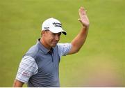 4 July 2019; Padraig Harrington of Ireland acknowledges the gallery after finishing his round on the 18th green during day one of the 2019 Dubai Duty Free Irish Open at Lahinch Golf Club in Lahinch, Clare. Photo by Ramsey Cardy/Sportsfile