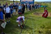 5 July 2019; Paul Waring of England moves television cables next to his ball off the 18th green during day two of the 2019 Dubai Duty Free Irish Open at Lahinch Golf Club in Lahinch, Clare. Photo by Brendan Moran/Sportsfile