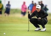 6 July 2019; Robin Dawson of Ireland lines up a putt on the 14th green during day three of the 2019 Dubai Duty Free Irish Open at Lahinch Golf Club in Lahinch, Clare. Photo by Ramsey Cardy/Sportsfile